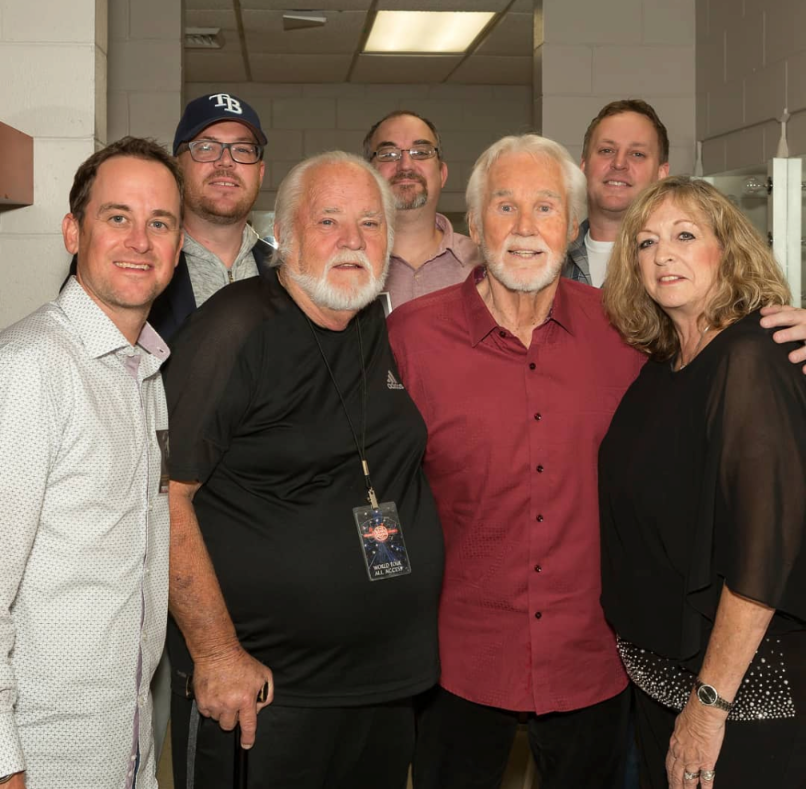Brad Rogers with his uncle Kenny Rogers and family backstage