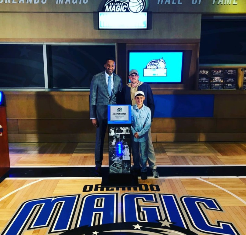 Brad Rogers and his son with Tracy McGrady at the Orlando Magic Hall of Fame