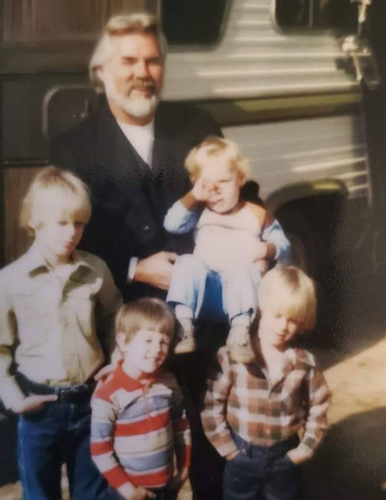 Vintage photo of Kenny Rogers with the Rogers children