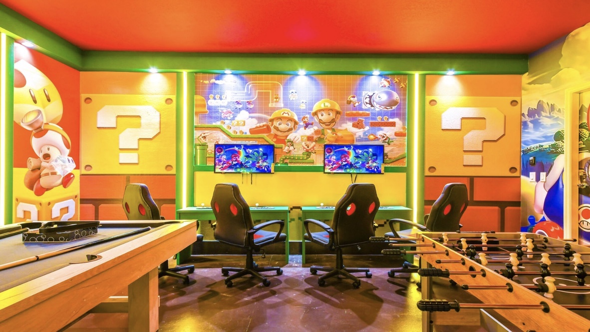 Super Mario themed game room with gaming stations and pool table