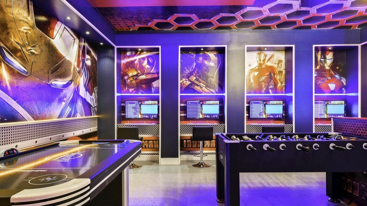 Iron Man themed game room with arcade stations and neon lighting